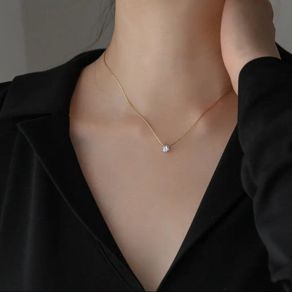 colgante con circonita redonda dorada