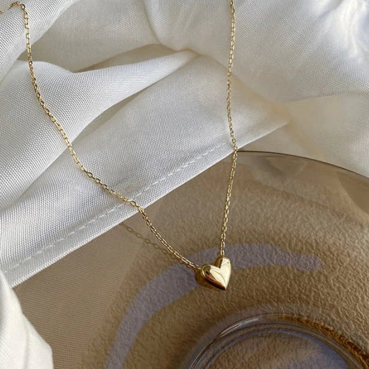 Colgante de corazón en acero inoxidable.