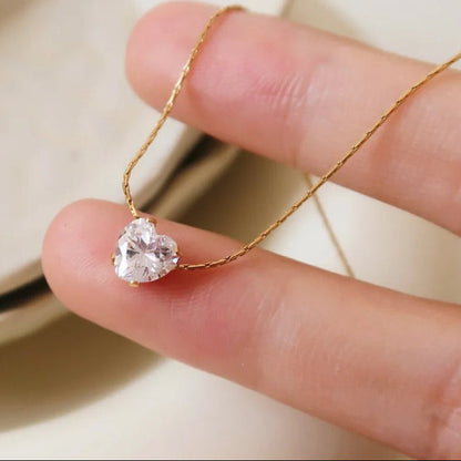 colgante con circonita redonda dorada