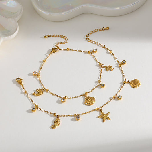 Tobillera Con Múltiples Dijes  marino, en acero inoxidable